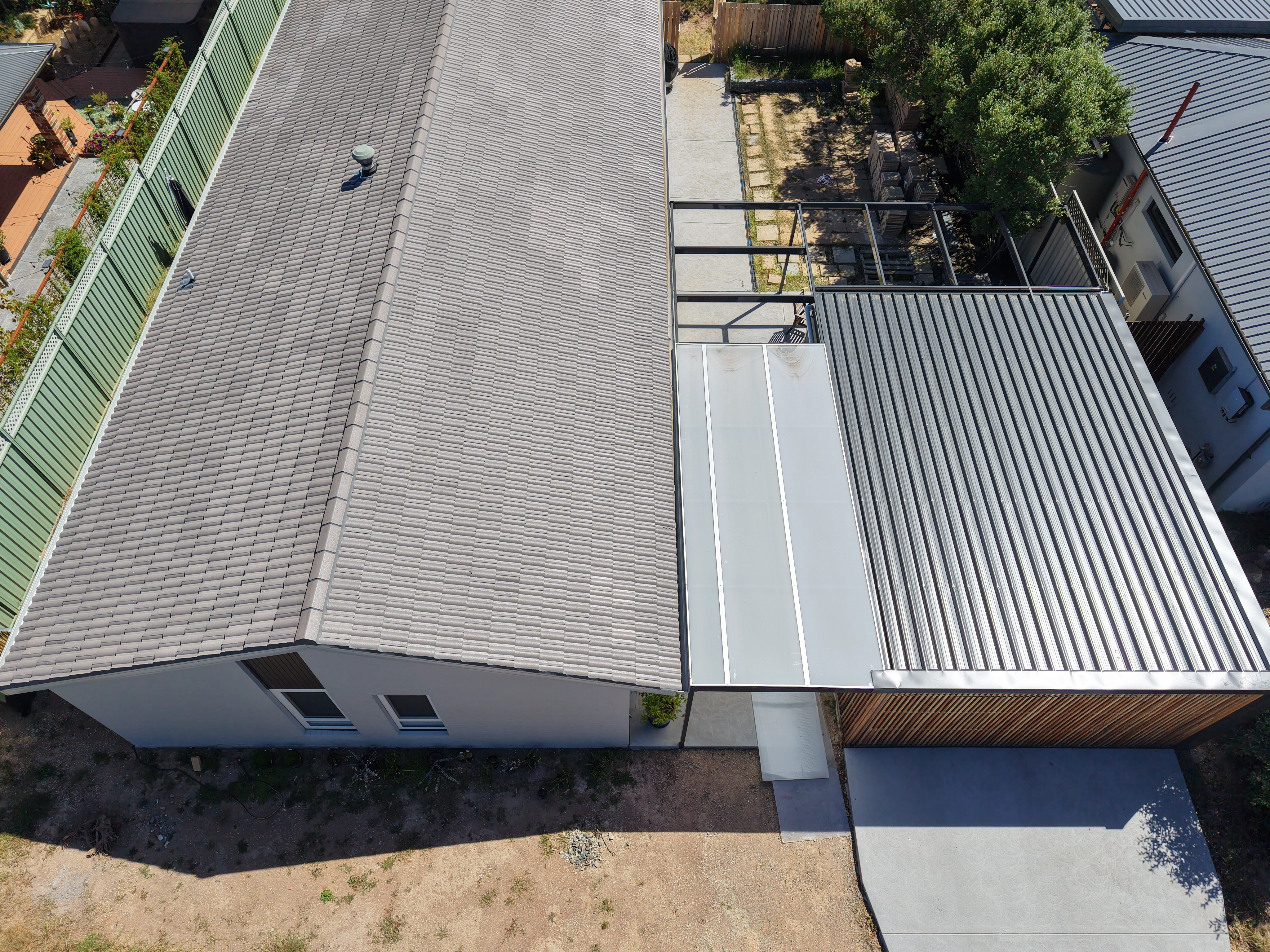 Tile Roofing project in Canberra, ACT by ShelterSafe - Three different roofs, one property—tile, twinwall porch, and Colorbond garage roof all done in a si... Concrete tile roof Canberra, ACT - professional maintenance