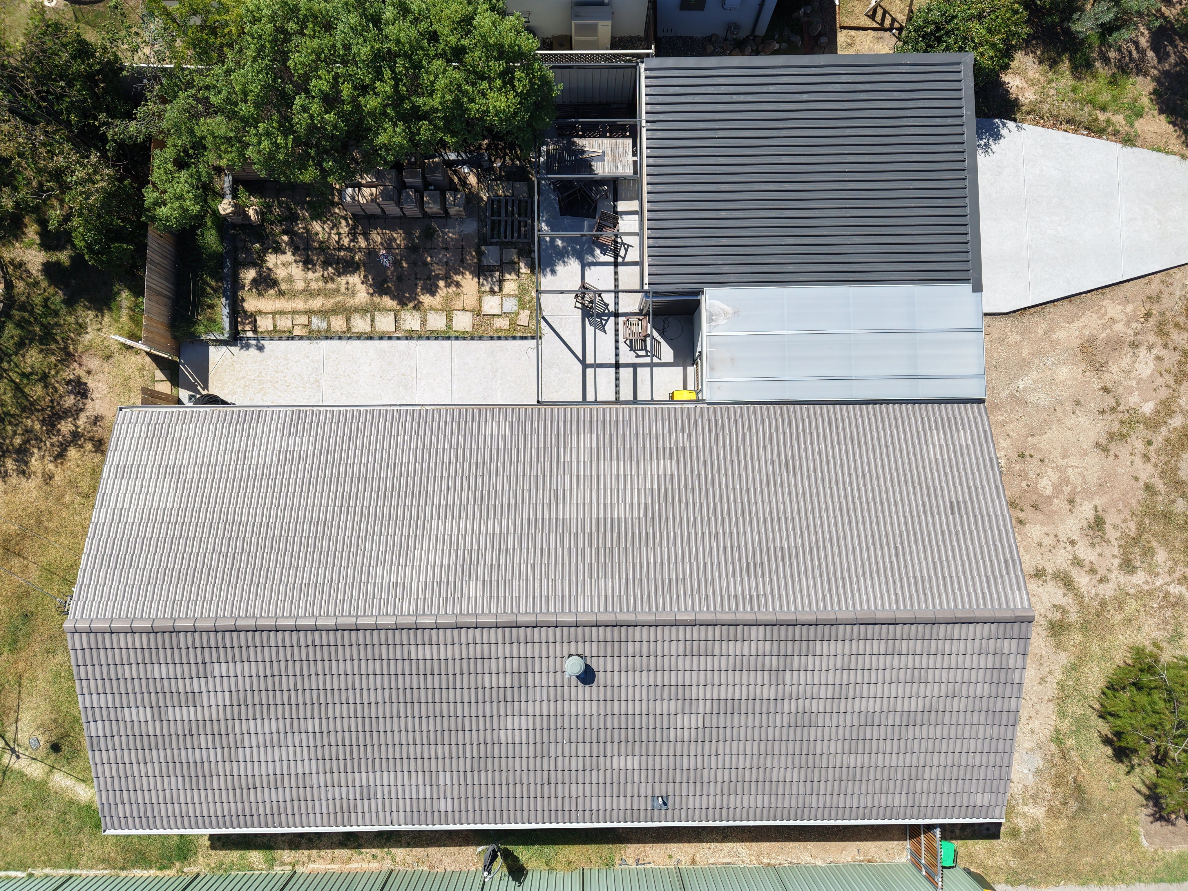 Tile Roofing project in Canberra, ACT by ShelterSafe - Three different roofs, one property—tile, twinwall porch, and Colorbond garage roof all done in a si... Tile roof restoration Canberra, ACT - ridge capping and pointing