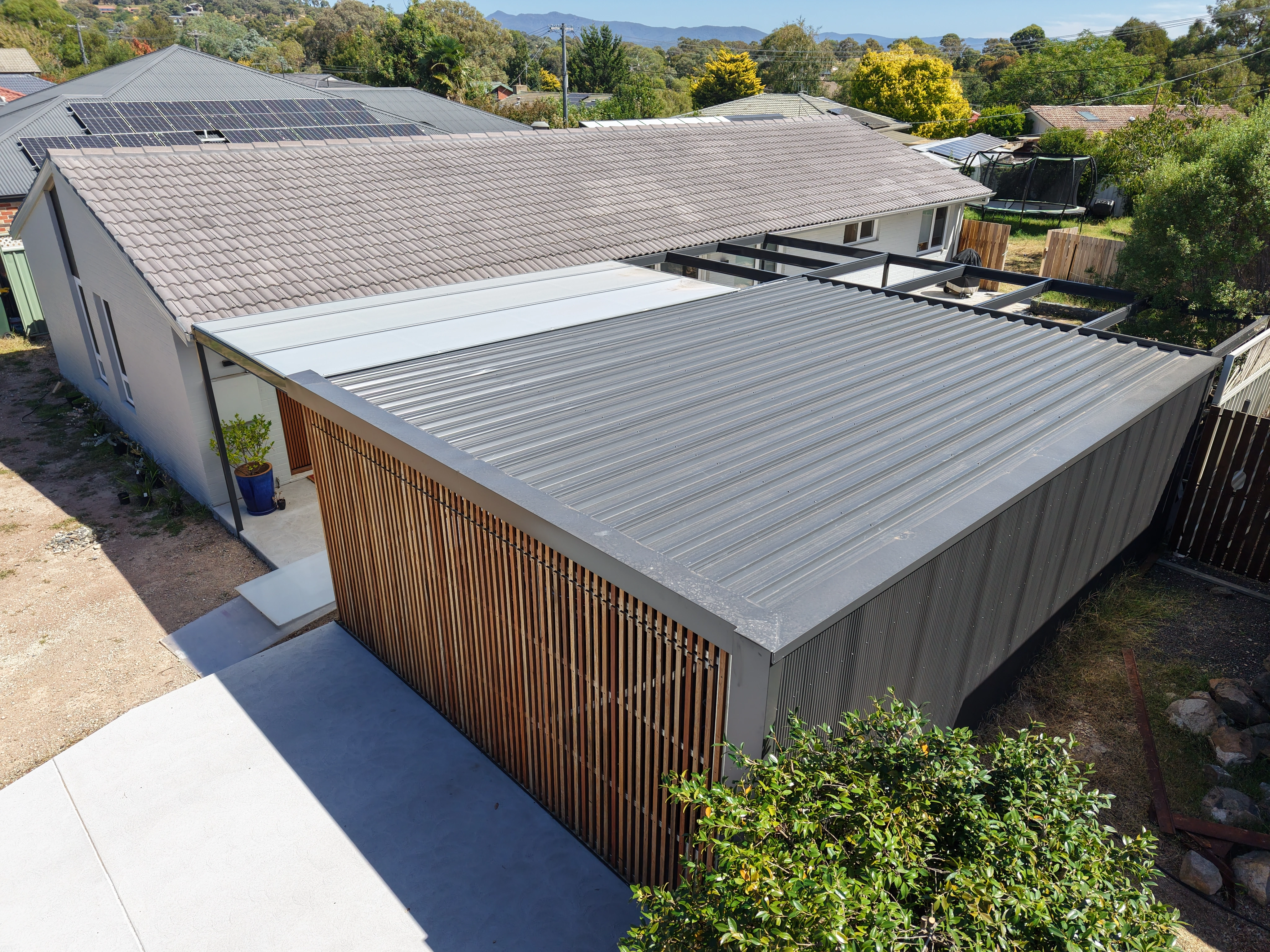Tile Roofing project in Canberra, ACT by ShelterSafe - Three different roofs, one property—tile, twinwall porch, and Colorbond garage roof all done in a si... Concrete tile roof Canberra, ACT - professional maintenance