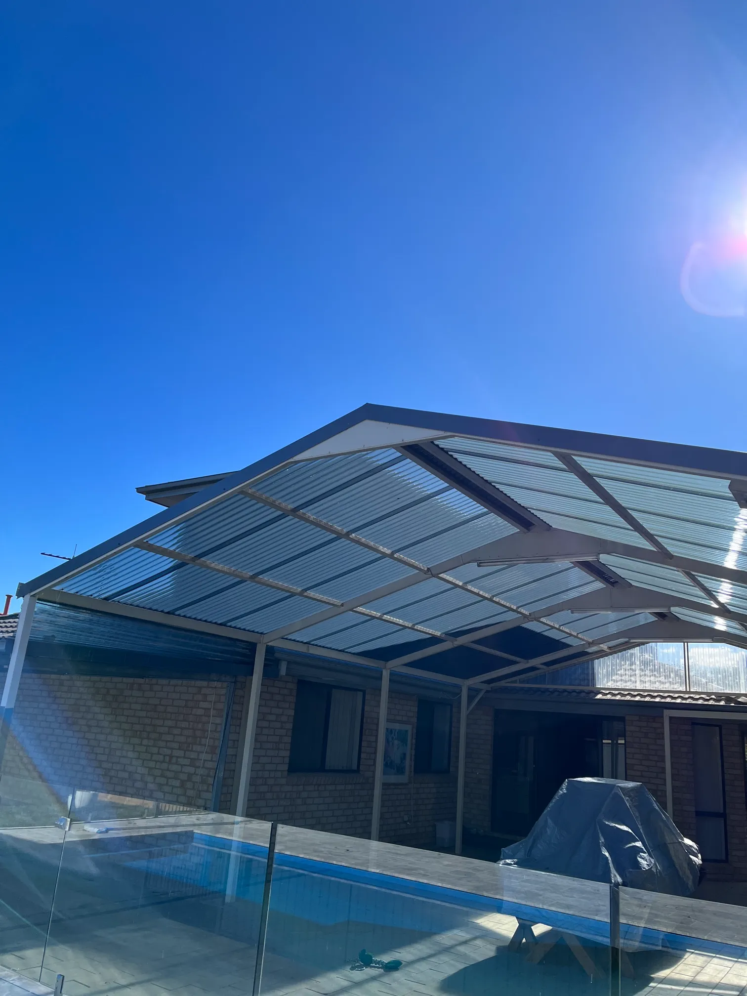 Polycarbonate Roofing project in Boorowa, NSW by ShelterSafe - Out in Boorowa, this patio took storm damage and needed new polycarbonate sheets. We replaced everyt... Clear patio roof Boorowa, NSW - polycarbonate installation