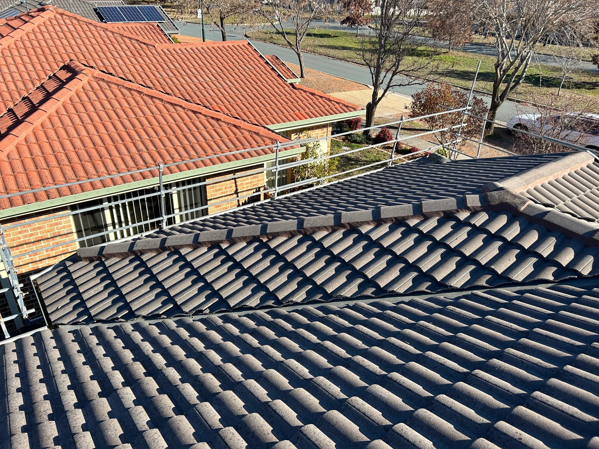 Tile Roofing project in Narrabundah, ACT by ShelterSafe - The ridge capping on this Narrabundah home was falling apart. We scraped out all the old bedding and... Tile roof restoration Narrabundah, ACT - ridge capping and pointing