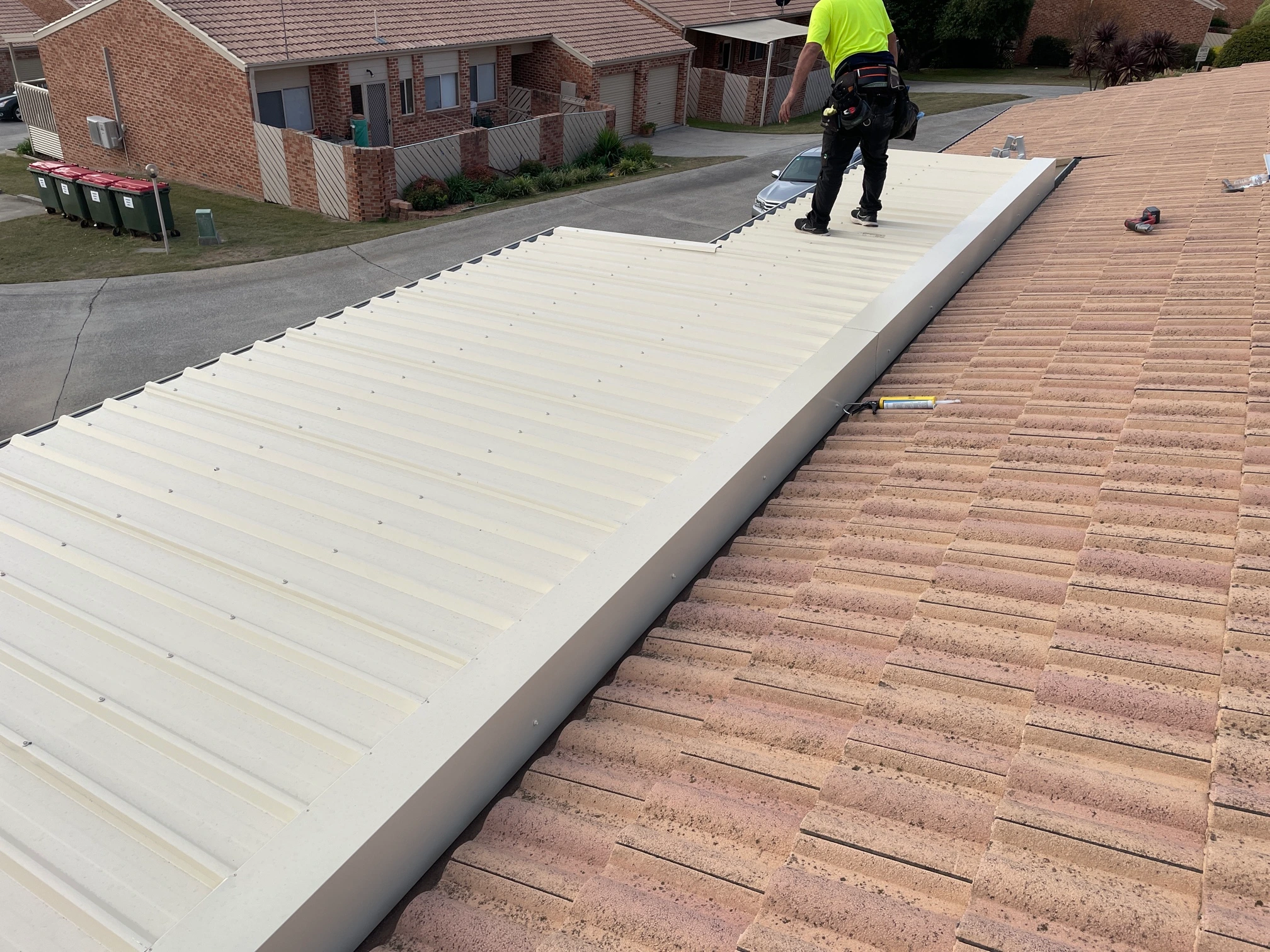 Metal Roofing project in Kambah, ACT by ShelterSafe - Hail tore through this Kambah pergola roof. We replaced all the Trimdek sheets and flashings in the ... Colorbond metal roof installation Kambah, ACT - professional roofing work