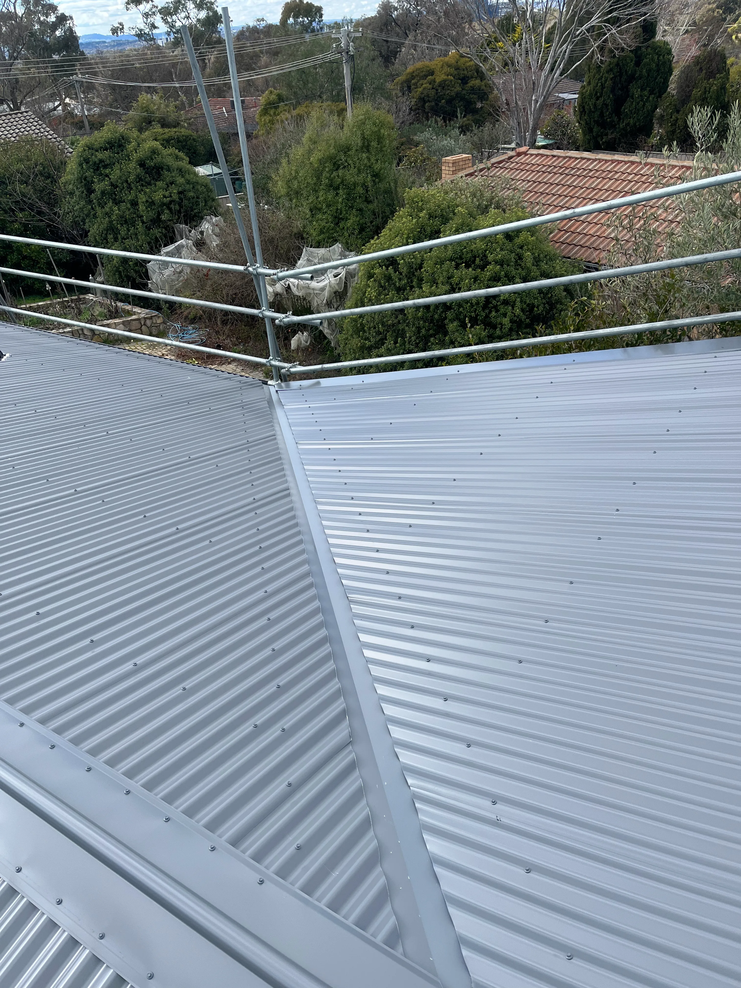 Metal Roofing project in Chifley, ACT by ShelterSafe - Hail left dents all over this Chifley roof. We gave it a complete makeover—new Colorbond Corrugated ... Colorbond metal roof installation Chifley, ACT - professional roofing work