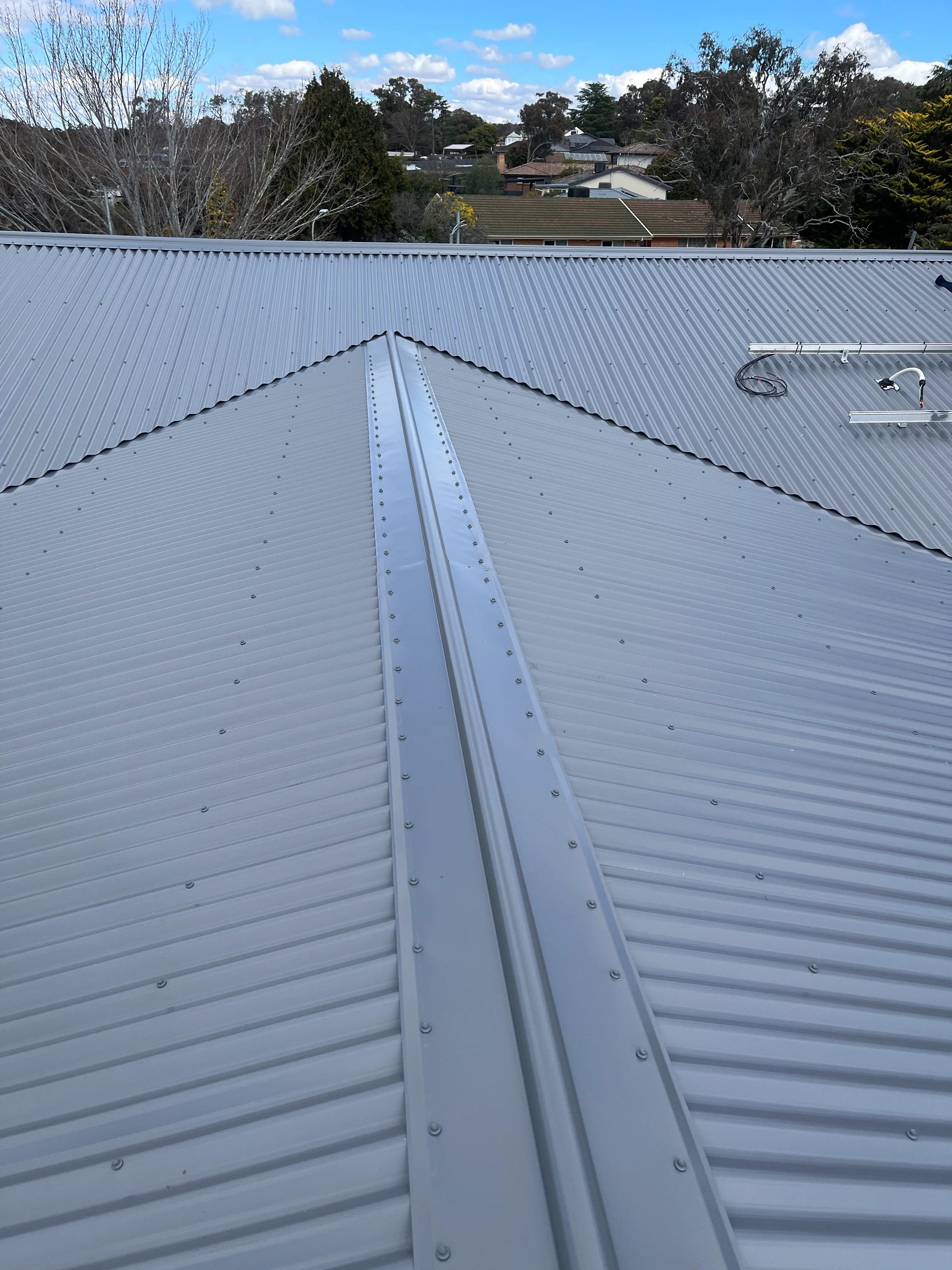 Metal Roofing project in Chifley, ACT by ShelterSafe - Hail left dents all over this Chifley roof. We gave it a complete makeover—new Colorbond Corrugated ... Metal roofing project Chifley, ACT - high quality finish