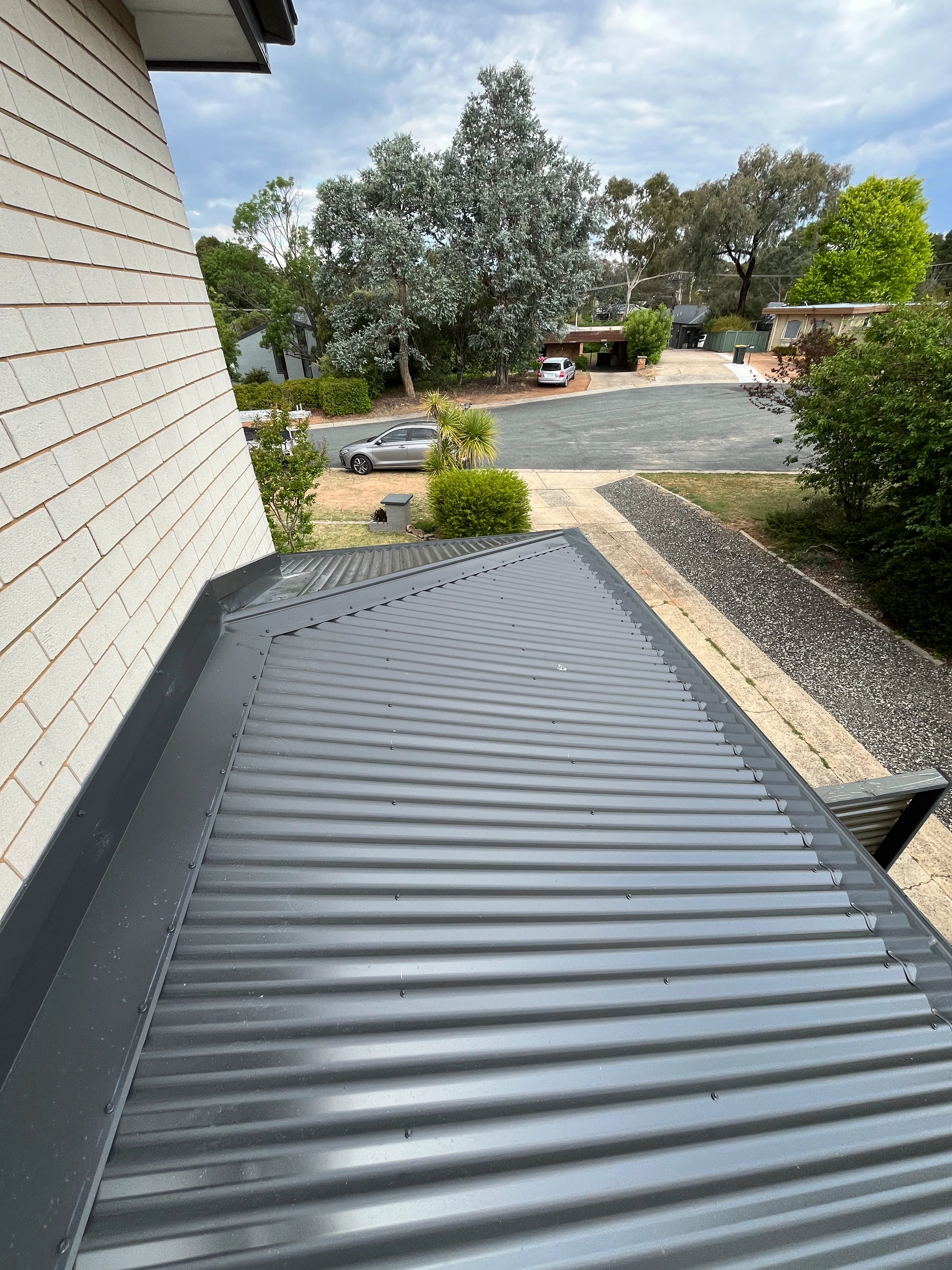 Metal Roofing project in Holt, ACT by ShelterSafe - Storm damage meant this Holt home needed a complete metal roof replacement. We stripped the old shee... Colorbond metal roof installation Holt, ACT - professional roofing work